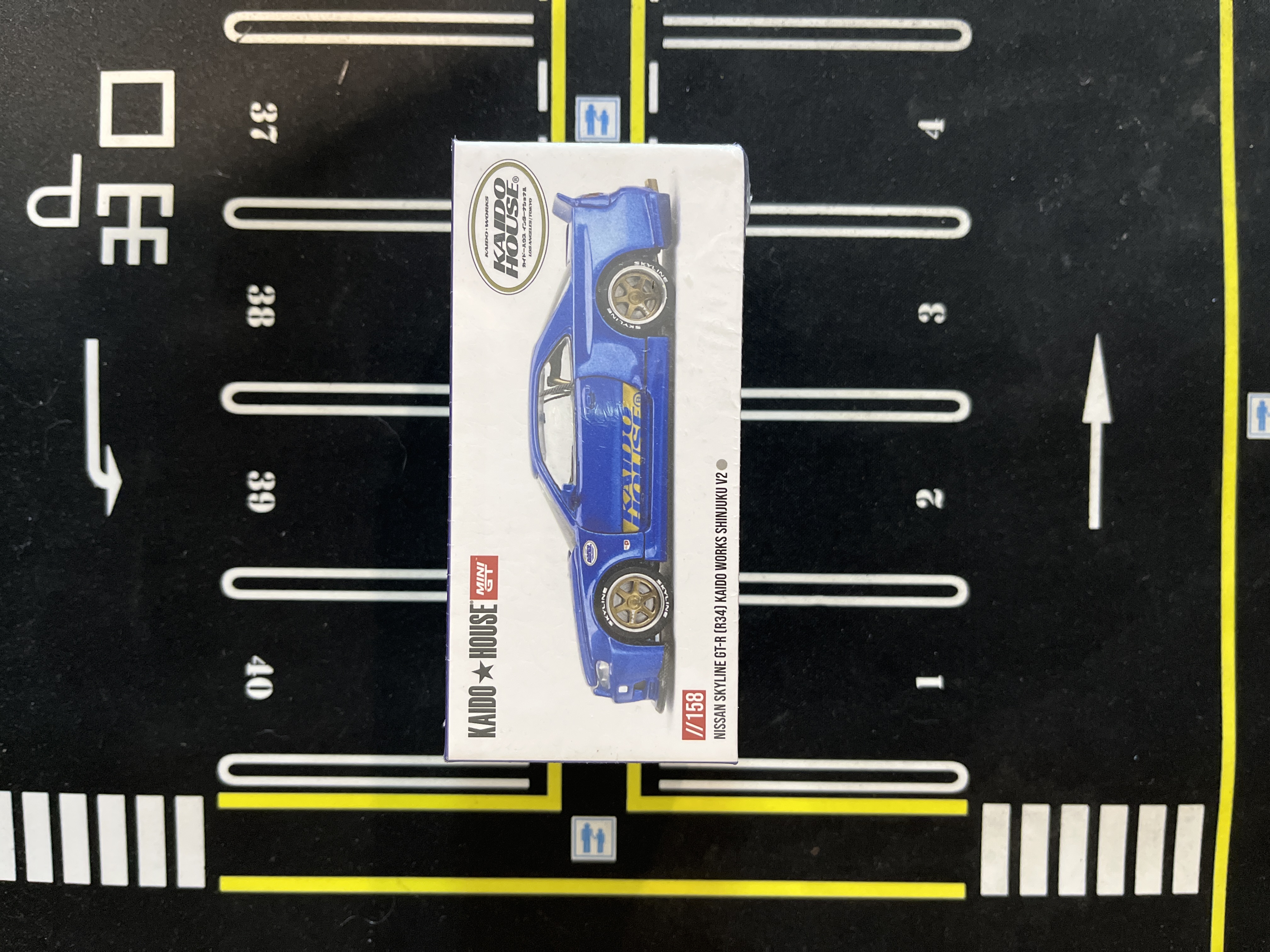 KHMG158 - Kaido House MiniGT Nissan Skyline GTR R34 Kaido House Works Shinjuku V2 ( Sealed )